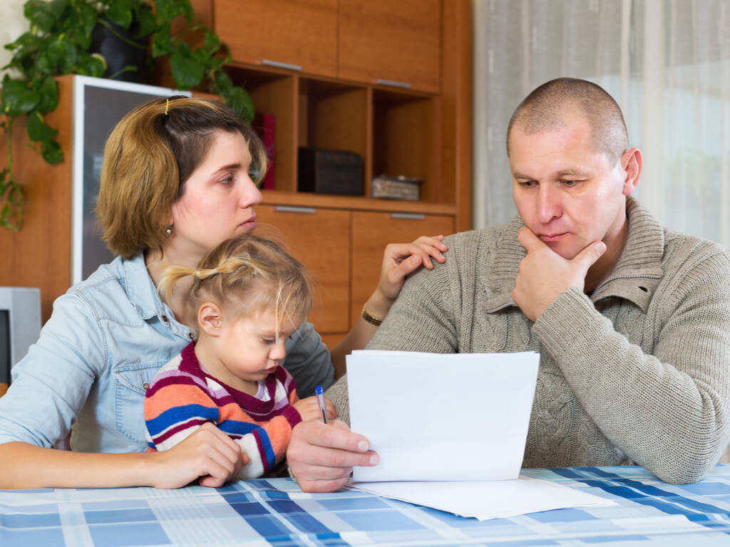 parents reviewing legal documents following divorce