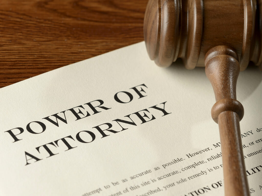 power of attorney documents with a gavel on top