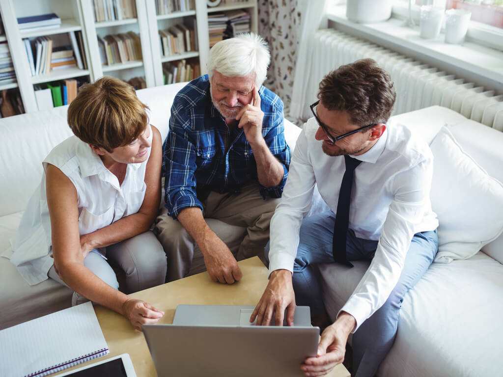 elderly couple meeting with an estate planning attorney