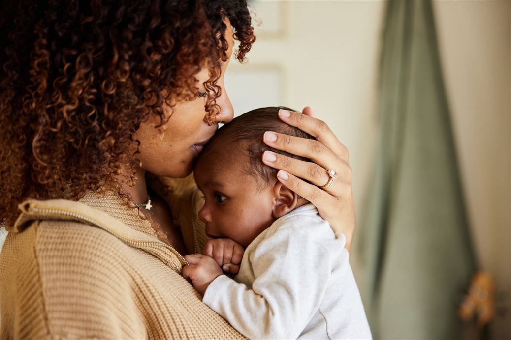 Woman with baby after managing estate disputes