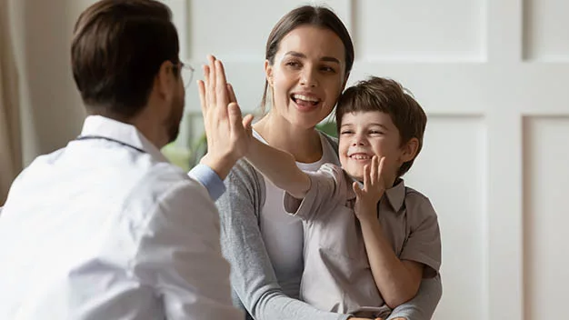 Boy high fives child custody lawyer