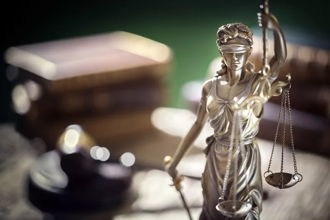 Lady Justice on Family Lawyer's desk